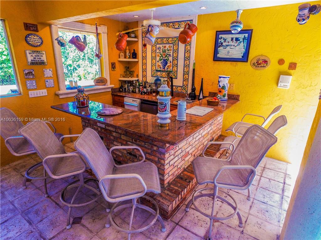6950 Granada Boulevard Coral Gables, FL 33146 - Photo 8 of 15 a dining room with furniture and wooden floor