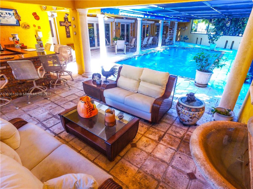6950 Granada Boulevard Coral Gables, FL 33146 - Photo 9 of 15 a outdoor living space with furniture and a potted plant