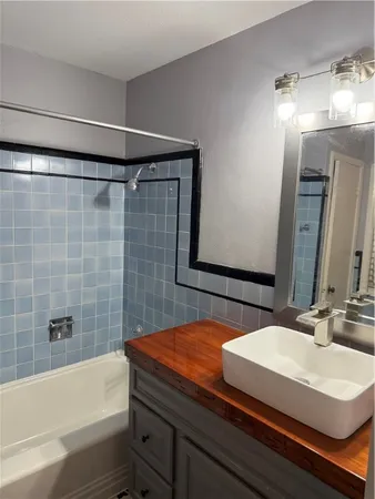 a bathroom with a sink and a bathtub