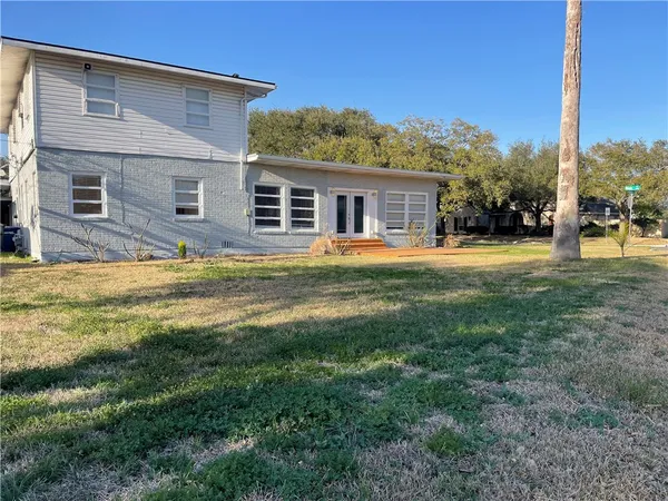 a view of a house with a big yard