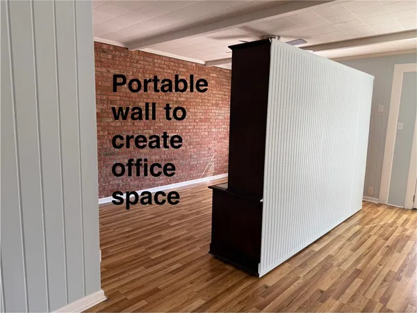 a view of a wooden door with wooden floor