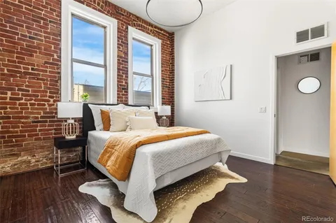 a bedroom with a bed and a night stand