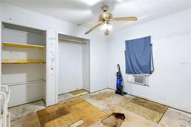 a bedroom with a bed and a mirror