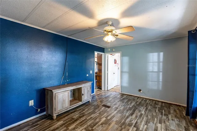 wooden floor in an empty room with a fireplace