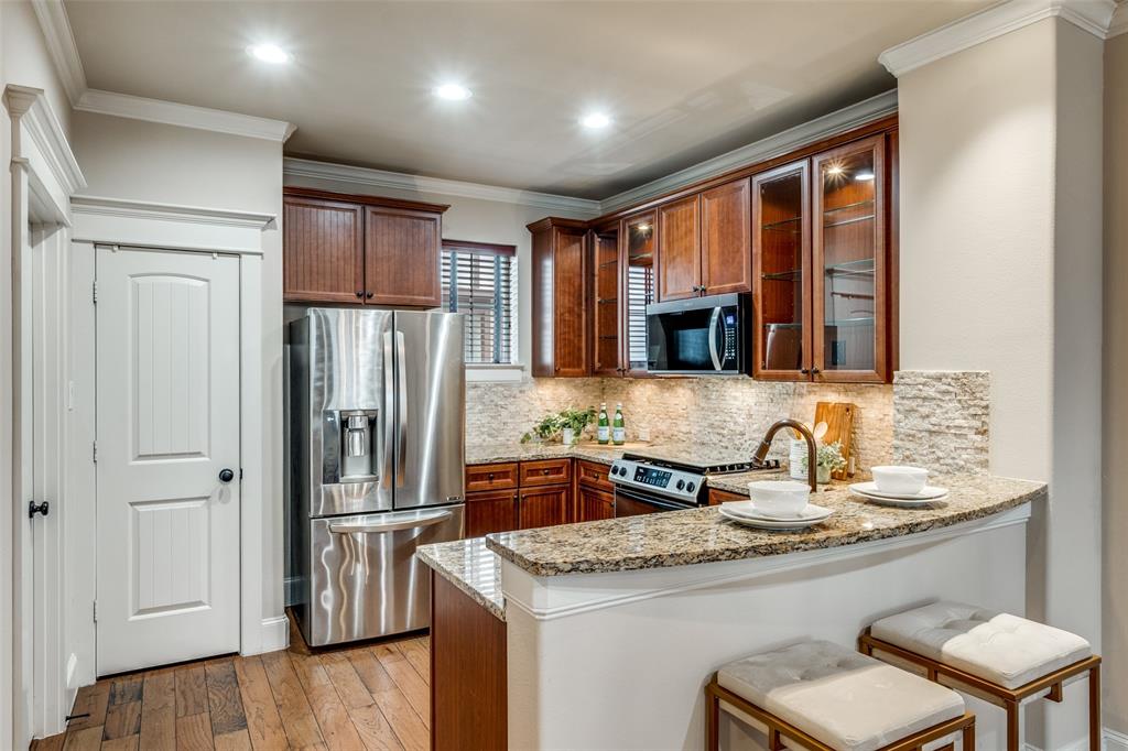 1600 Abrams Road, Unit 54 Dallas, TX 75214 - Photo 11 of 23 a kitchen with stainless steel appliances granite countertop a refrigerator and a sink
