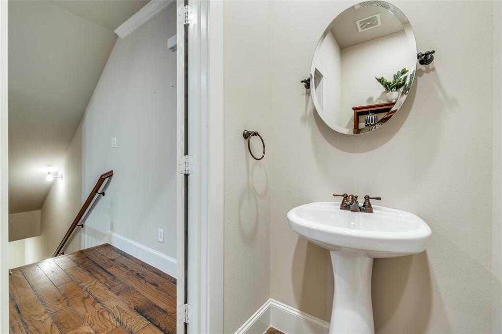 1600 Abrams Road, Unit 54 Dallas, TX 75214 - Photo 15 of 23 a bathroom with a sink a mirror and wooden floor
