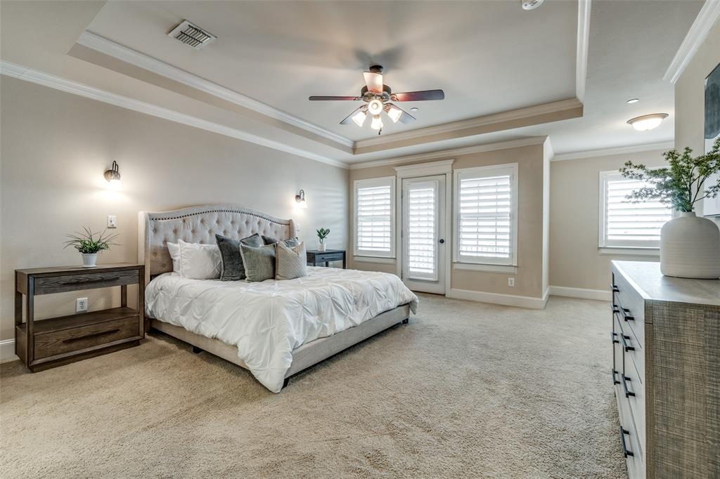 1600 Abrams Road, Unit 54 Dallas, TX 75214 - Photo 16 of 23 a spacious bedroom with a bed and a chandelier