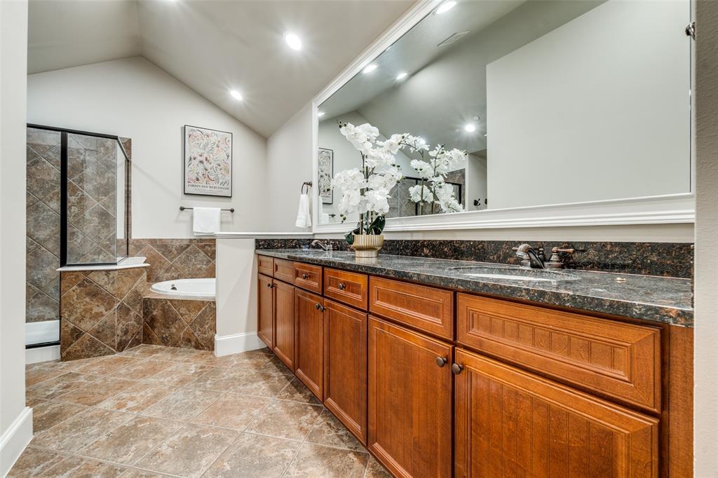1600 Abrams Road, Unit 54 Dallas, TX 75214 - Photo 18 of 23 a spacious bathroom with a granite countertop sink and a mirror