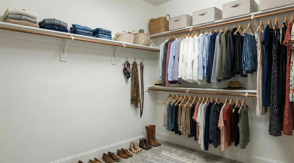 1600 Abrams Road, Unit 54 Dallas, TX 75214 - Photo 20 of 23 a view of walk in closet with clothes and shoes