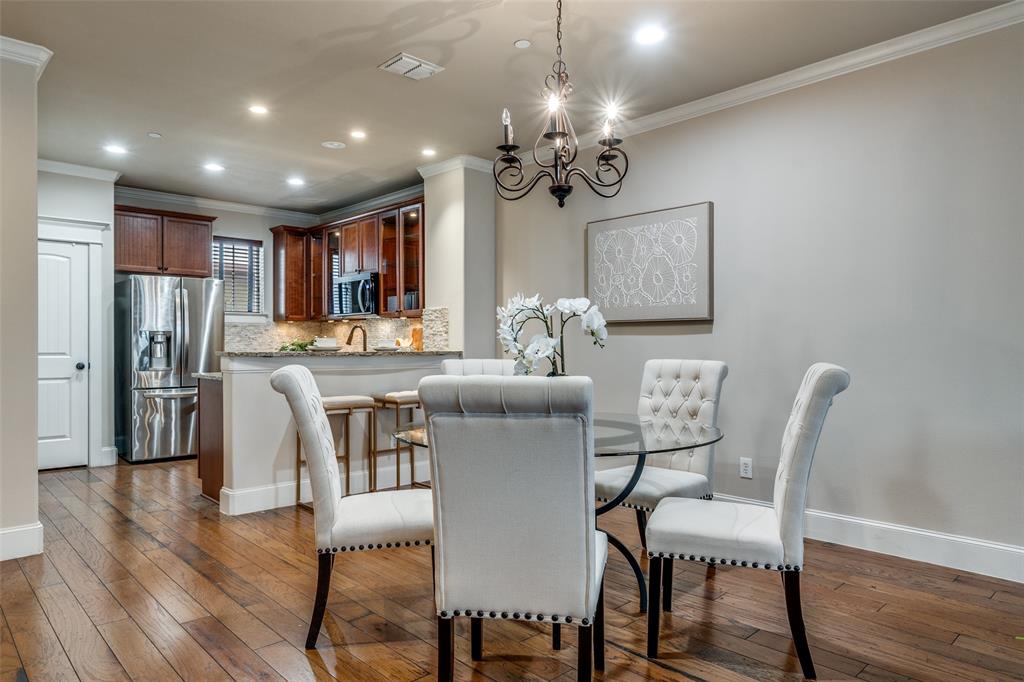 1600 Abrams Road, Unit 54 Dallas, TX 75214 - Photo 9 of 23 a dining room with furniture a chandelier and wooden floor