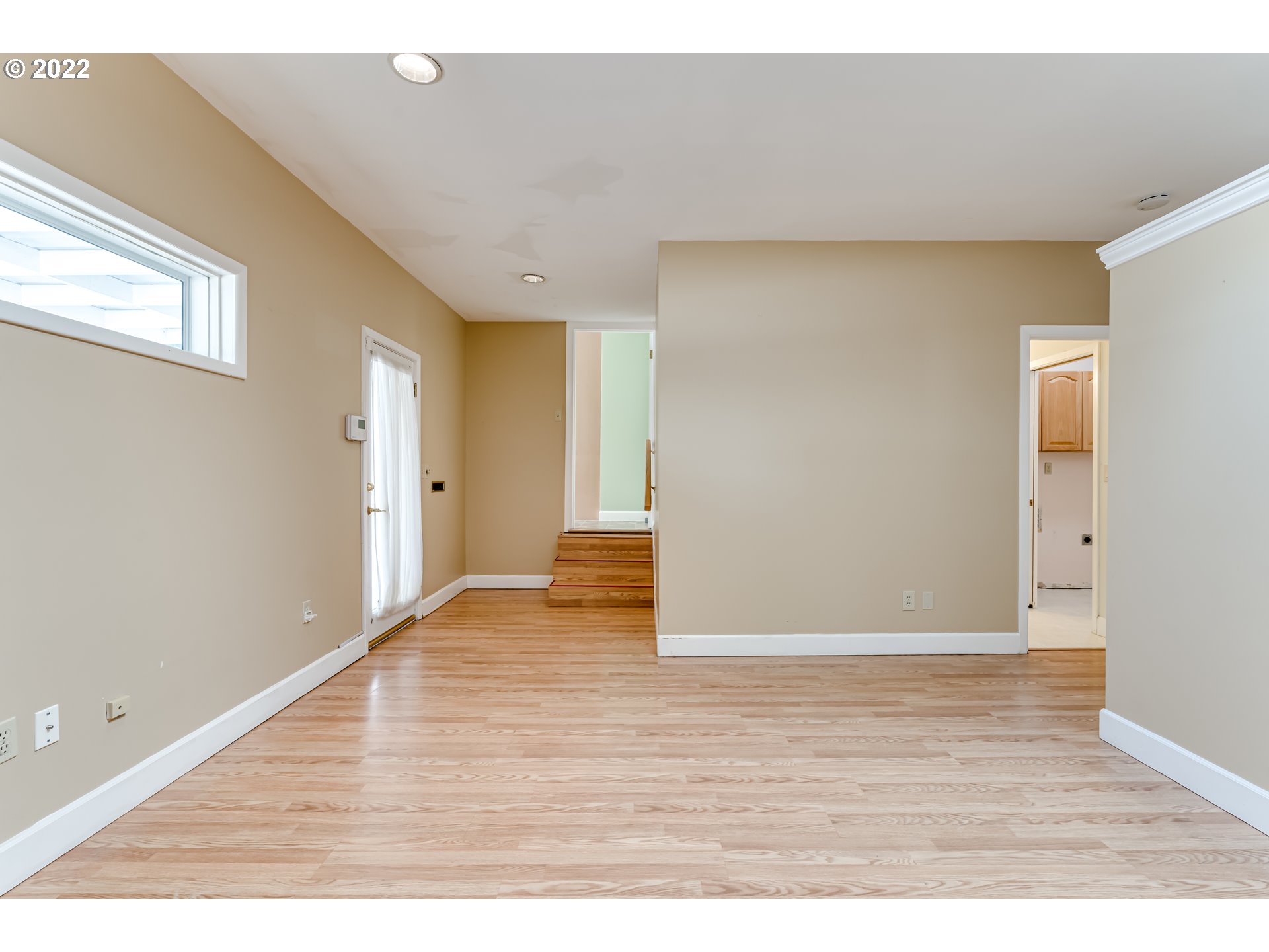 595 Dartmoor Drive Eugene, OR 97401 - Photo 11 of 32 a view of an empty room with wooden floor