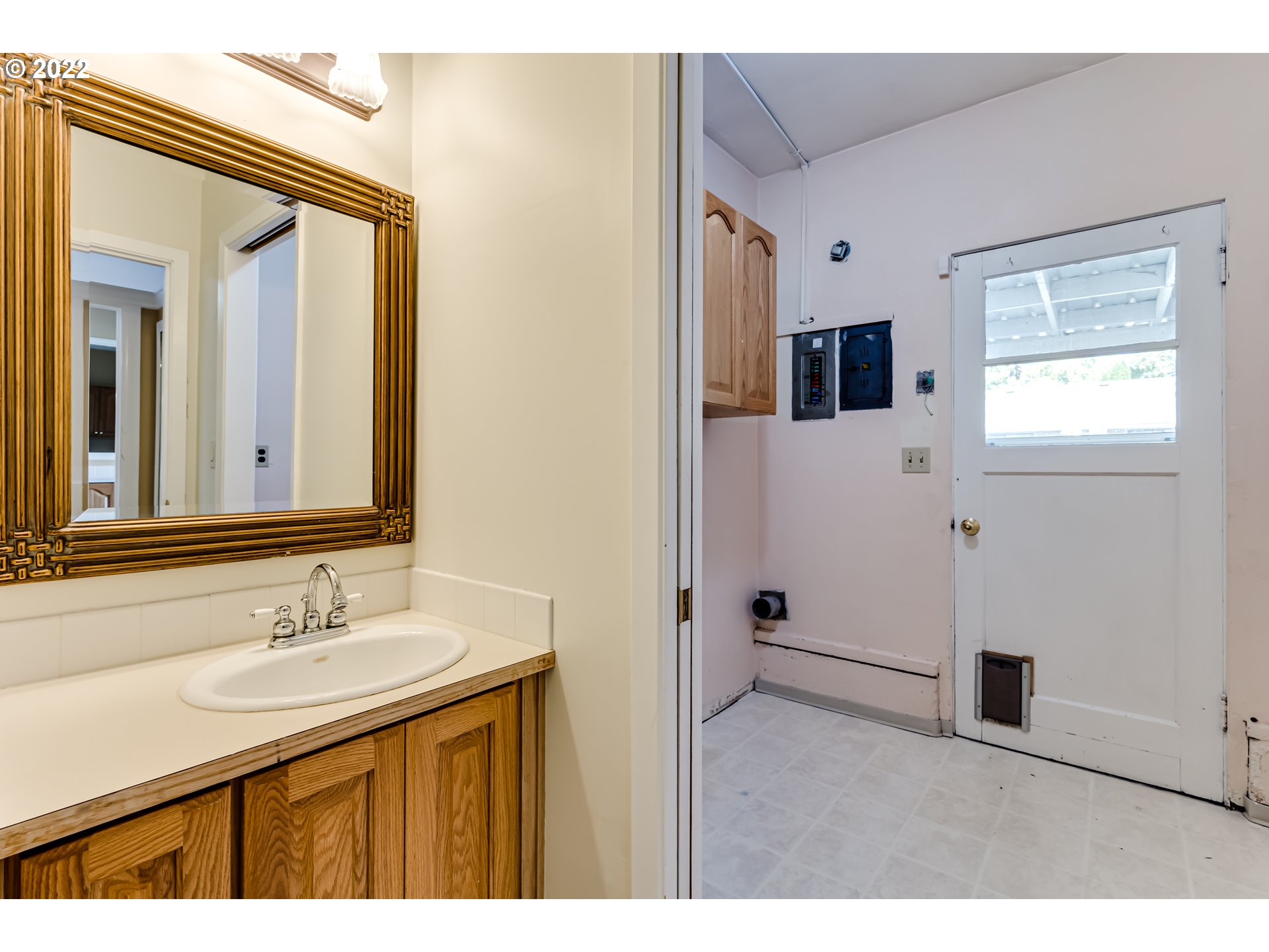 595 Dartmoor Drive Eugene, OR 97401 - Photo 16 of 32 a bathroom with a sink a mirror and shower