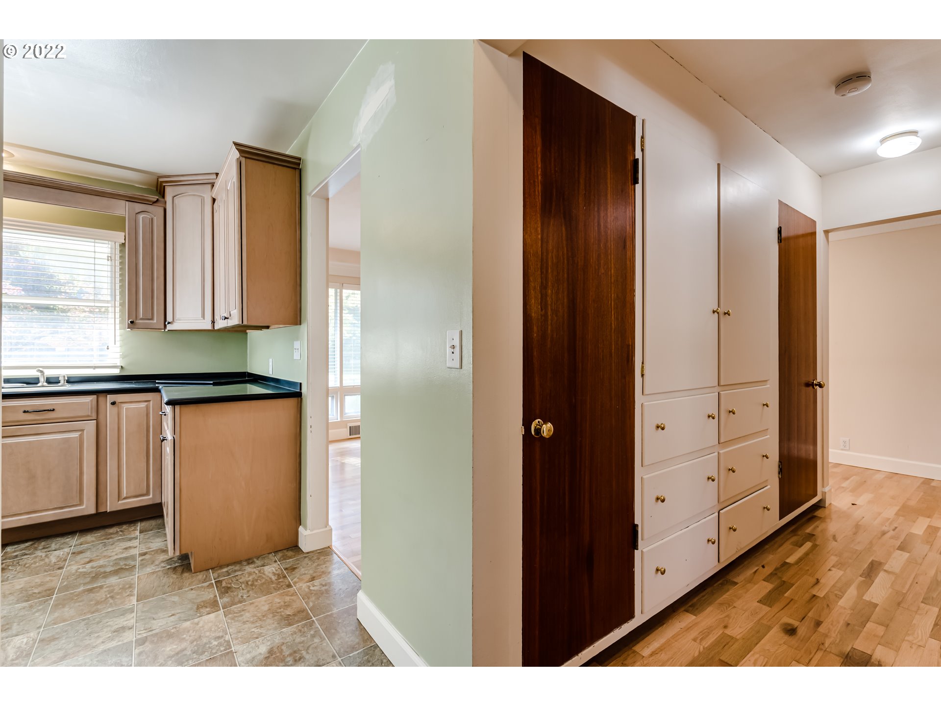 595 Dartmoor Drive Eugene, OR 97401 - Photo 18 of 32 a view of kitchen with granite countertop cabinets and a wooden floor