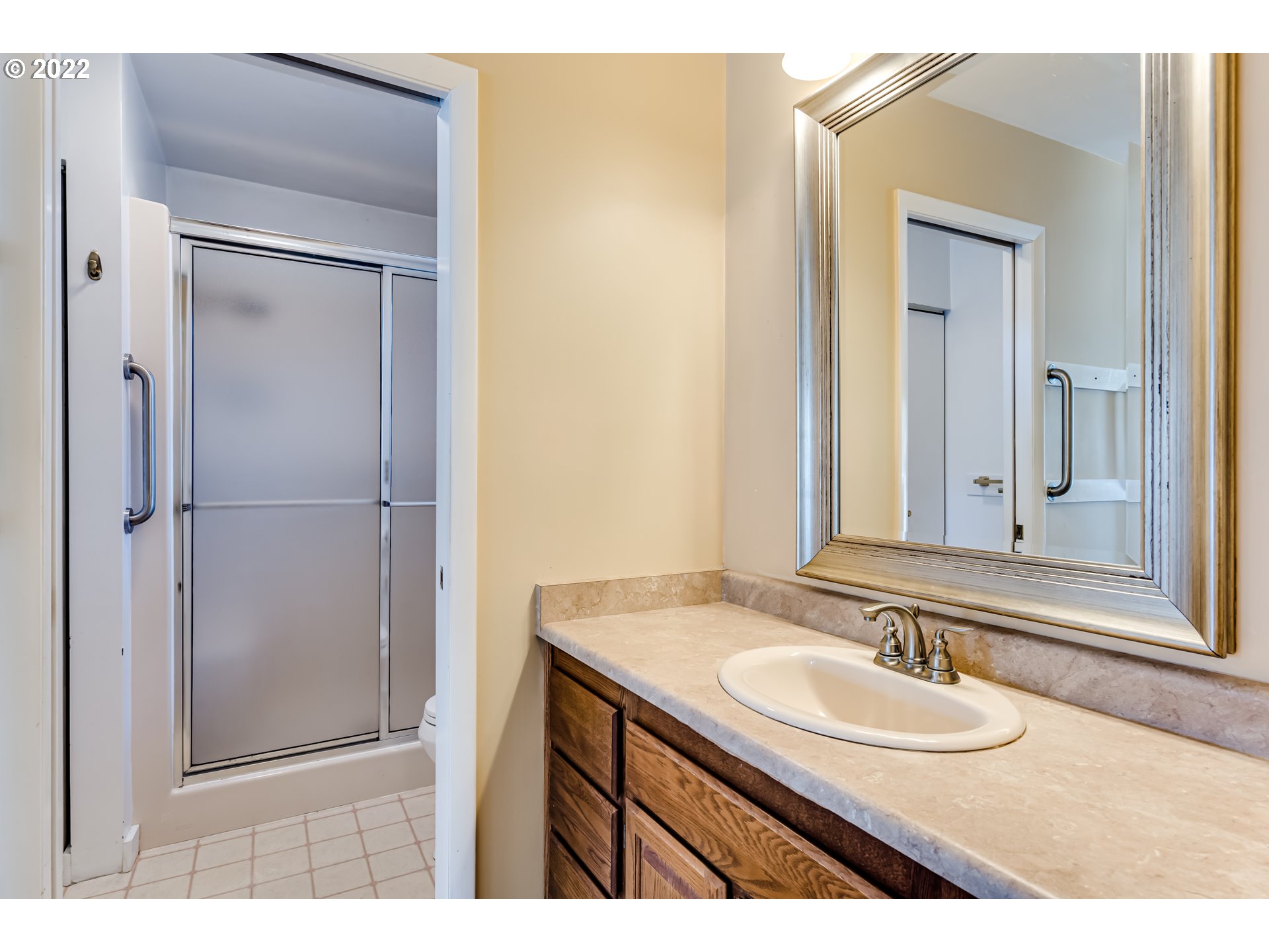 595 Dartmoor Drive Eugene, OR 97401 - Photo 27 of 32 a bathroom with a sink and a mirror