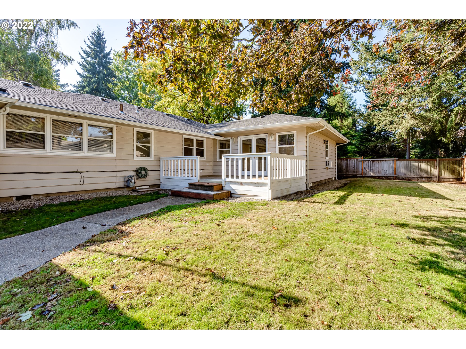 595 Dartmoor Drive Eugene, OR 97401 - Photo 28 of 32 a front view of a house with a yard table and chairs
