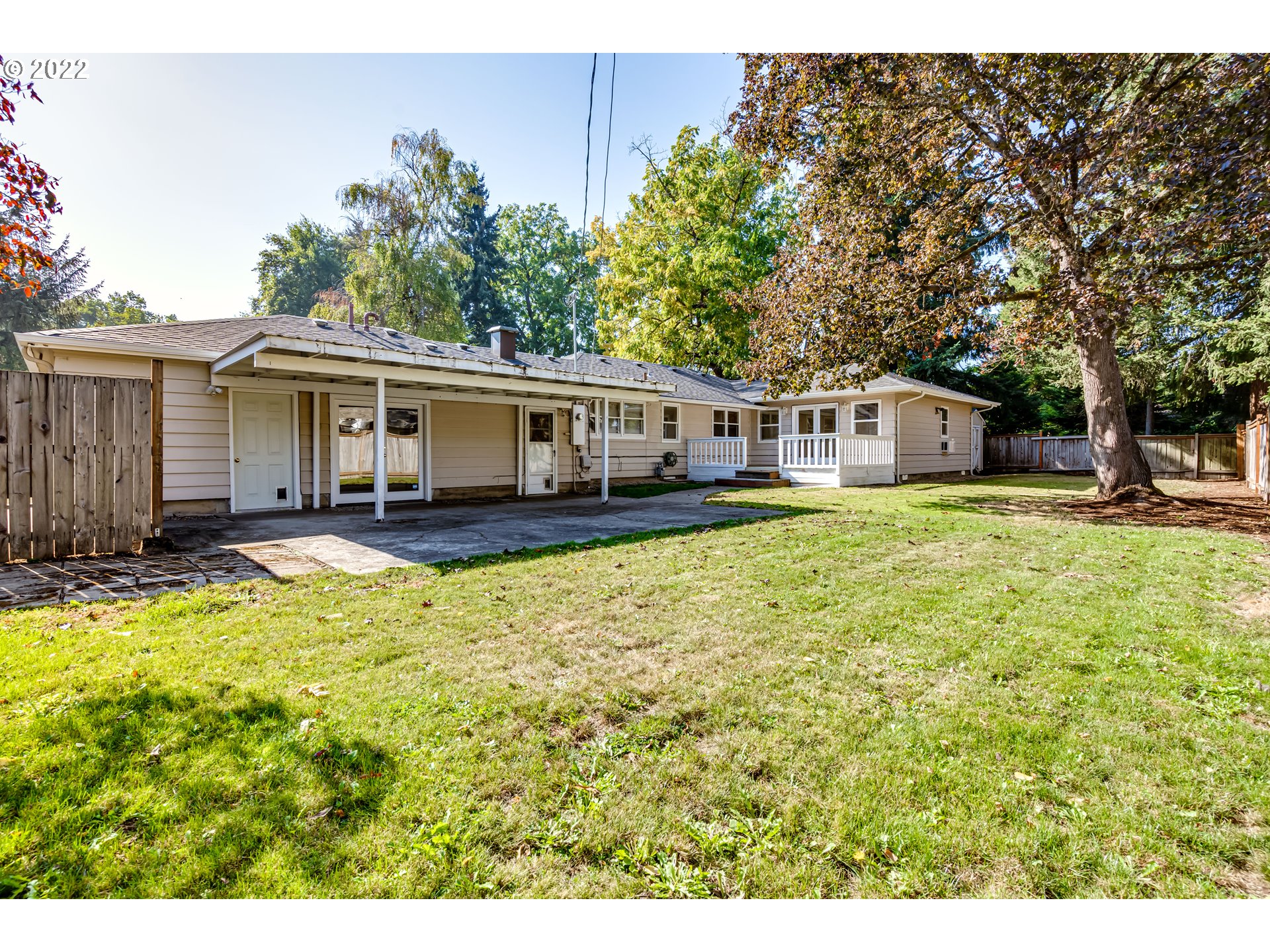 595 Dartmoor Drive Eugene, OR 97401 - Photo 29 of 32 a view of a house with pool and trees in the background