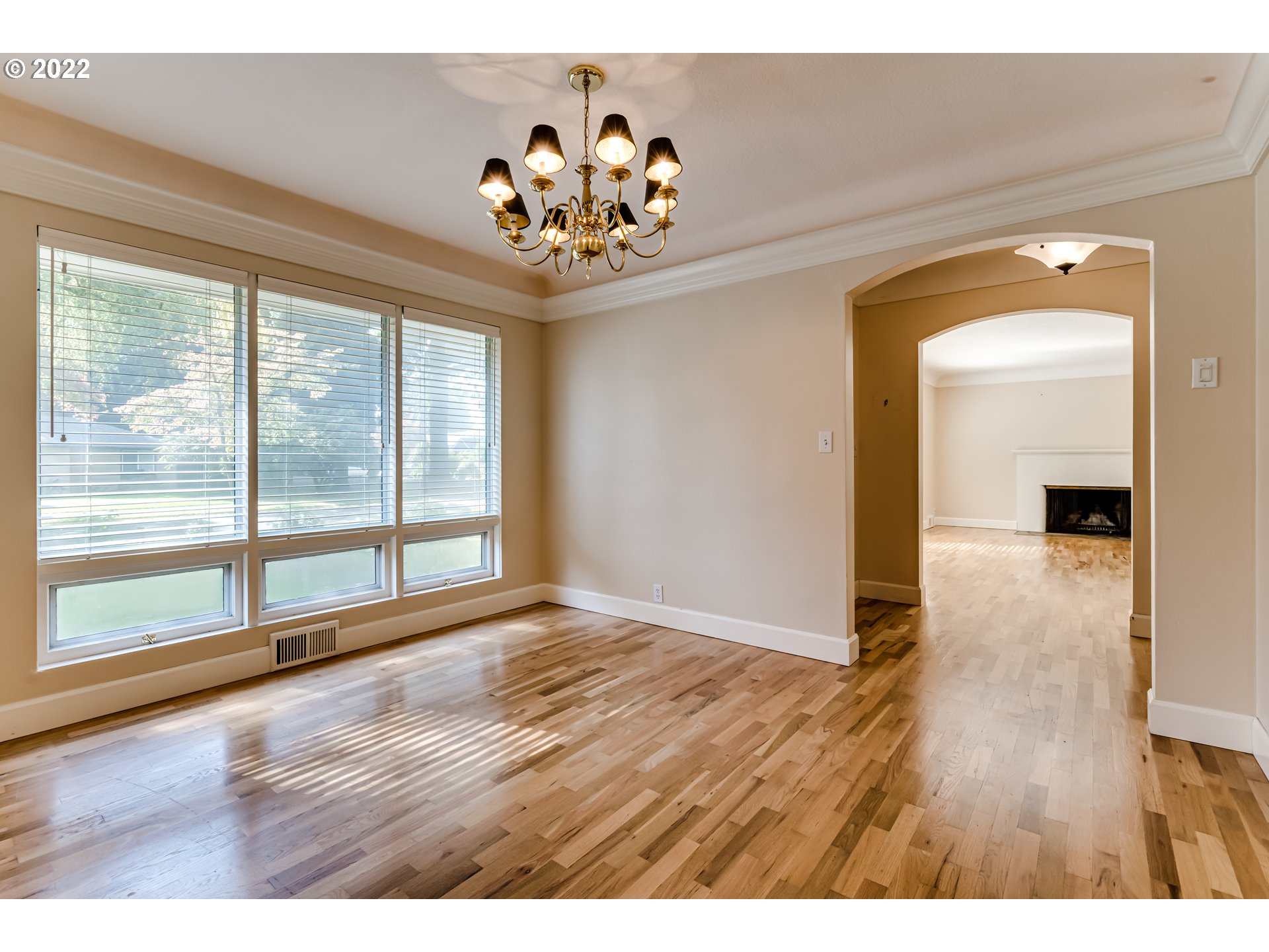 595 Dartmoor Drive Eugene, OR 97401 - Photo 4 of 32 a view of an empty room with wooden floor and a window