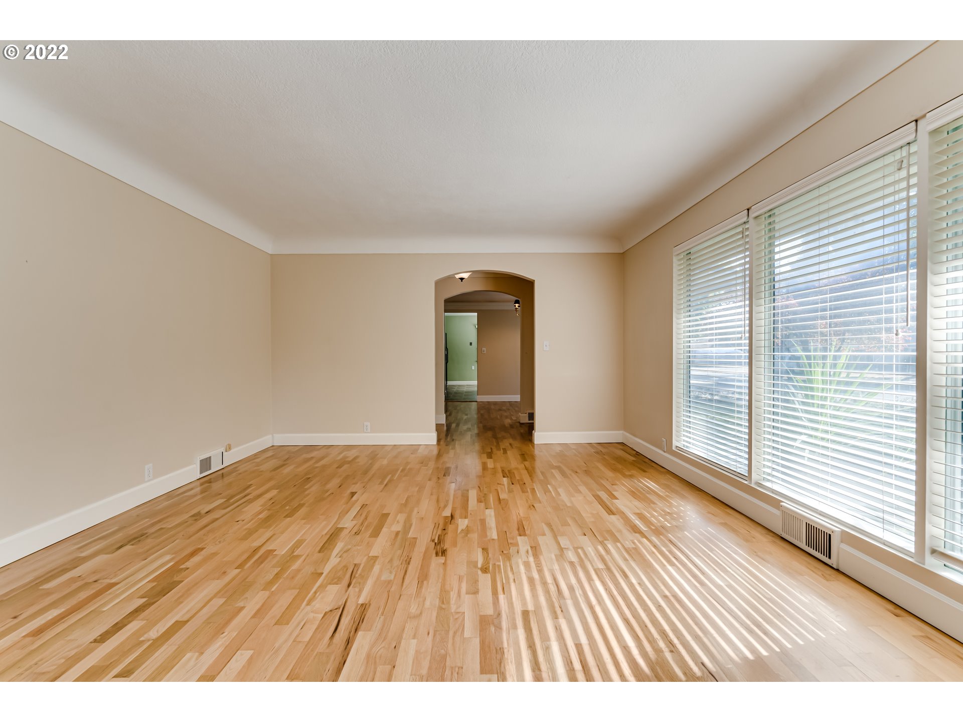 595 Dartmoor Drive Eugene, OR 97401 - Photo 6 of 32 a view of empty room with wooden floor and fan