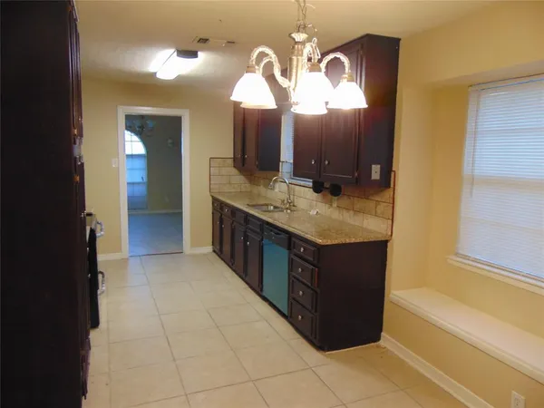 a bathroom with a double vanity sink mirror and bathtub