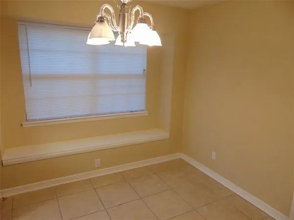 a view of empty room with a fireplace