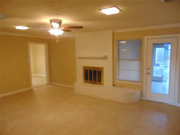 a view of a empty room with a fireplace