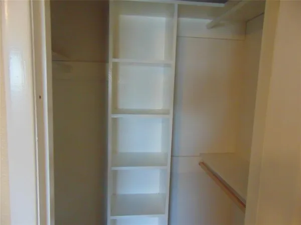 a close up view of walk in closet