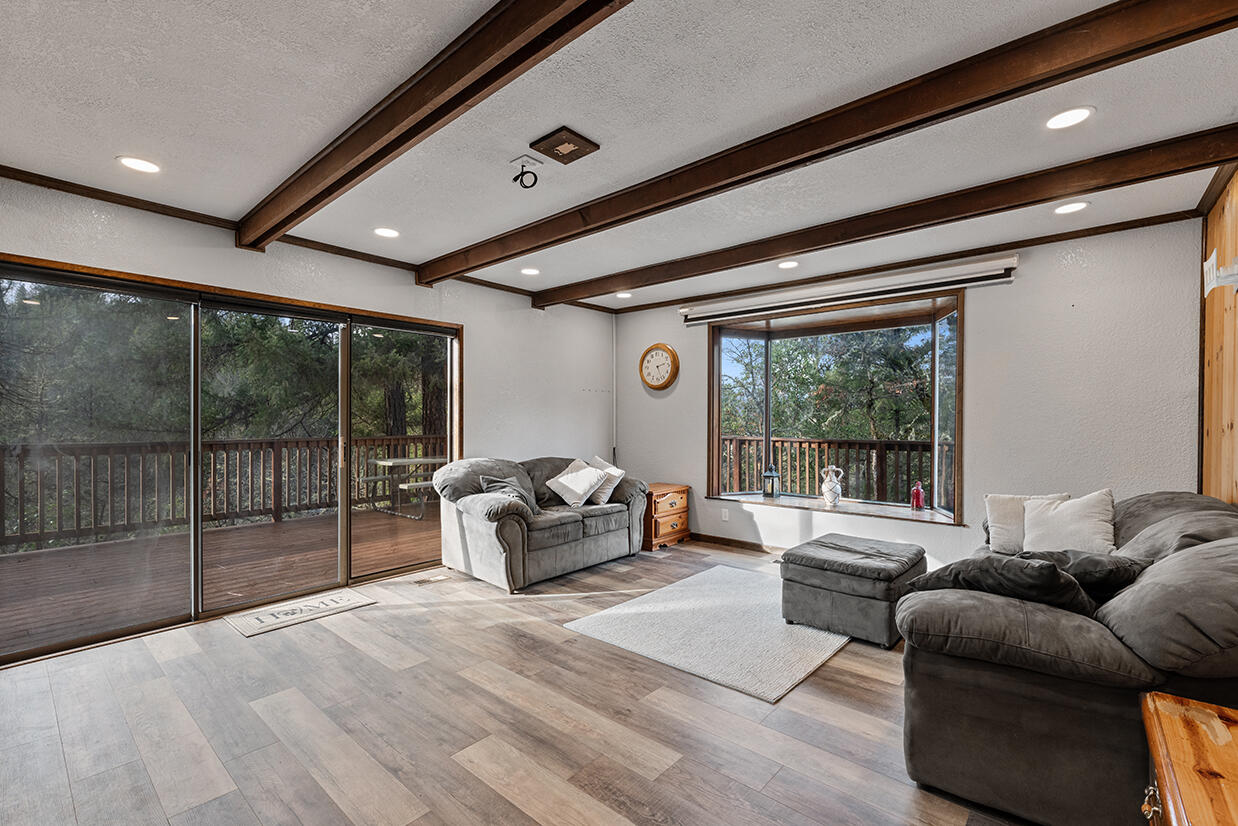 2900 Indian Creek Road Shady Cove, OR 97539 - Photo 11 of 35 a living room with furniture and a large window