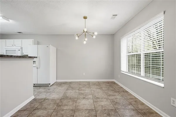 a view of a kitchen with dishwasher and a window