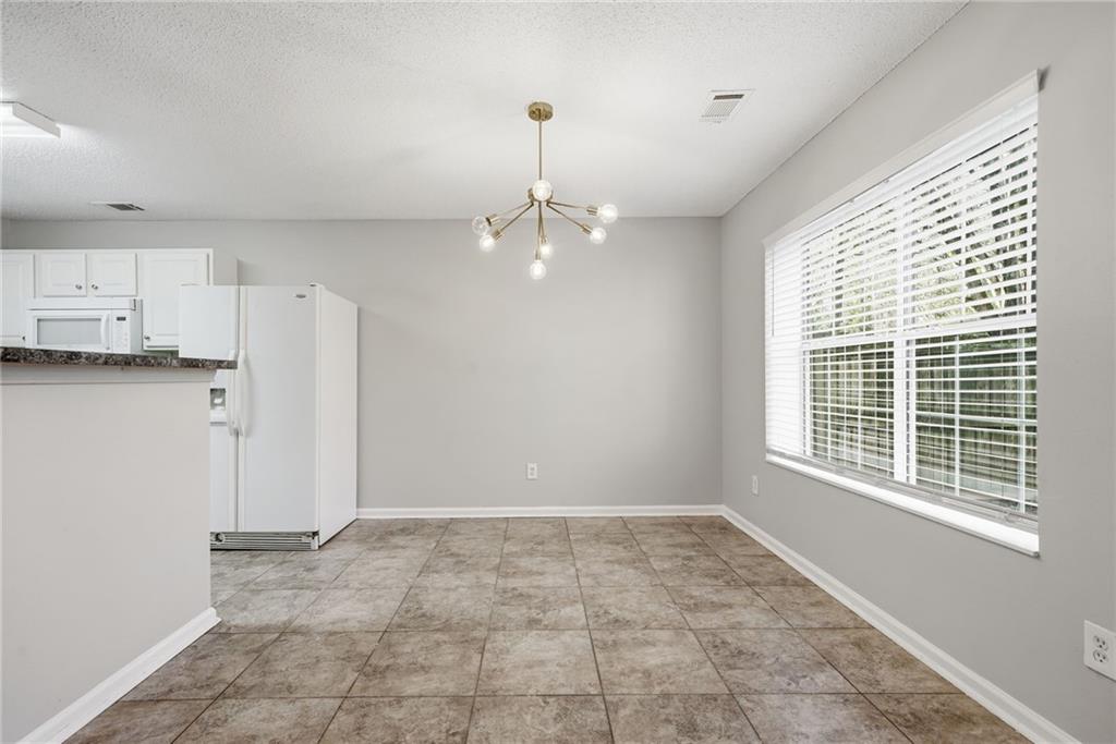 2297 Charleston Pointe Southeast Atlanta, GA 30316 - Photo 15 of 48 a view of a kitchen with dishwasher and a window