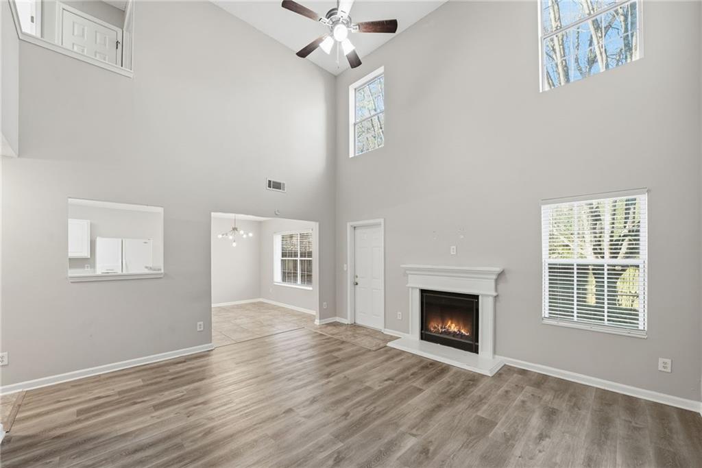 2297 Charleston Pointe Southeast Atlanta, GA 30316 - Photo 19 of 48 a view of an empty room with wooden floor and a window