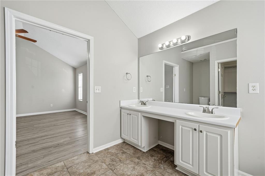 2297 Charleston Pointe Southeast Atlanta, GA 30316 - Photo 31 of 48 a bathroom with a double vanity sink and a mirror