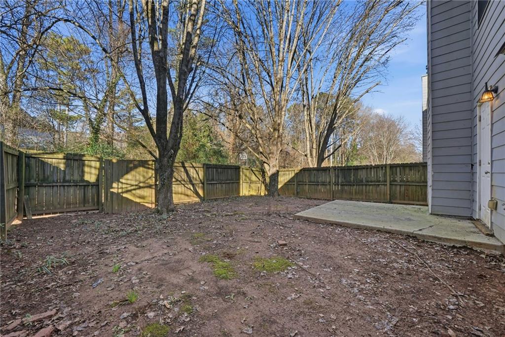 2297 Charleston Pointe Southeast Atlanta, GA 30316 - Photo 36 of 48 a view of a backyard with large trees