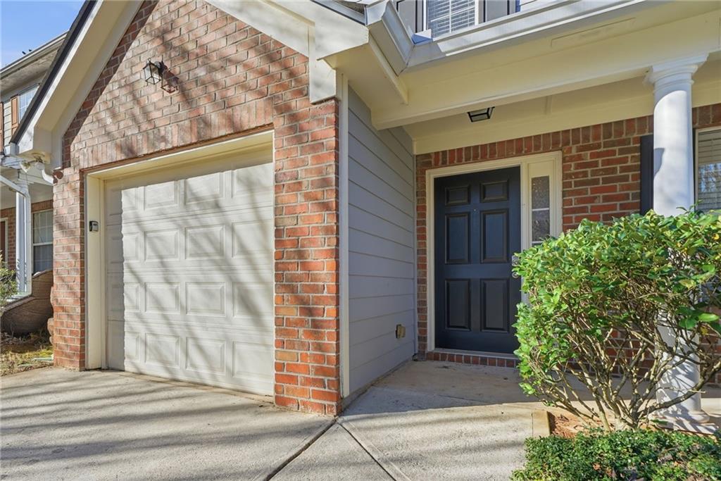 2297 Charleston Pointe Southeast Atlanta, GA 30316 - Photo 37 of 48 a front view of a house with a garden