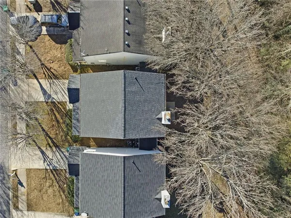 a aerial view of a house with a yard