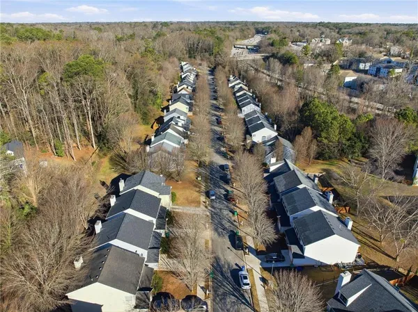 an aerial view of residential houses with outdoor space