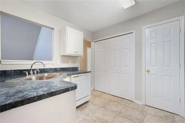a kitchen with granite countertop a sink and a granite counter tops
