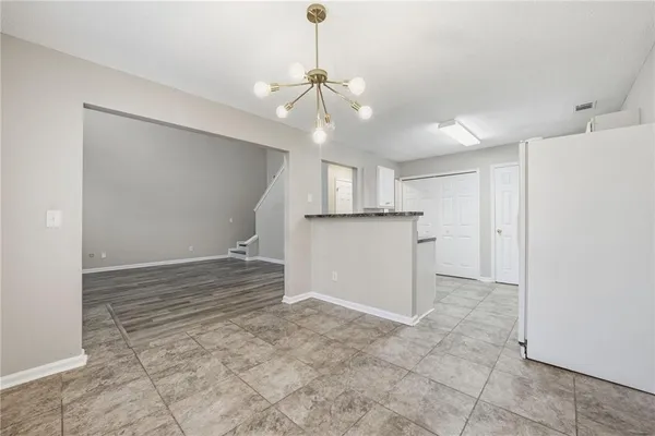 a view of a kitchen with a sink and a window