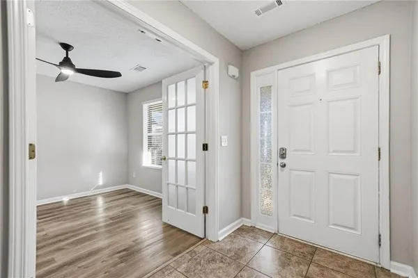 a view of entryway with wooden floor