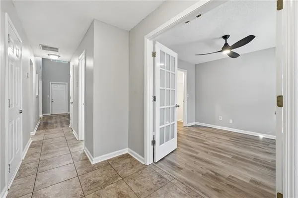 a view of a hallway with a white walls
