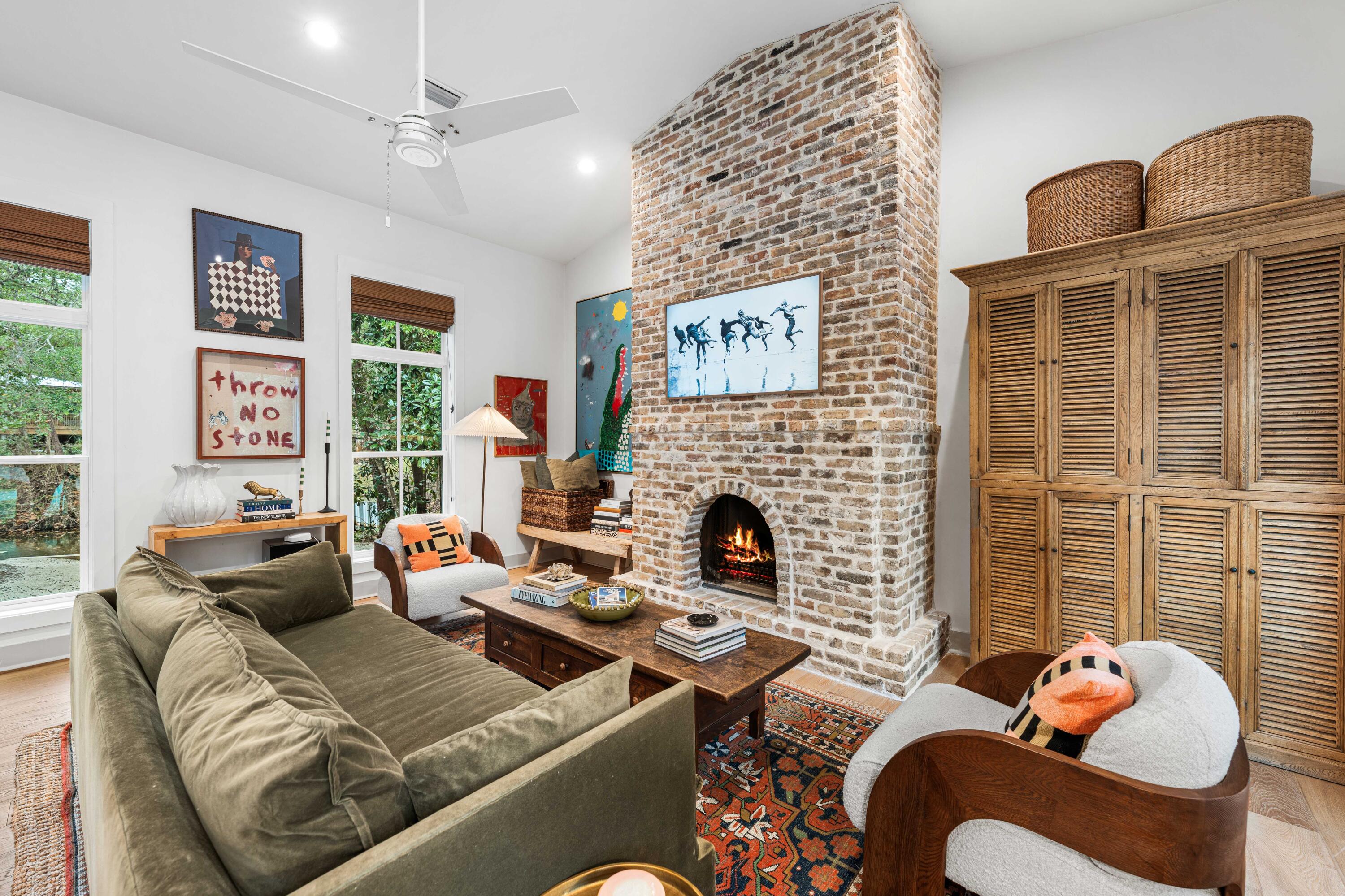 294 West Point Washington Road Santa Rosa Beach, FL 32459 - Photo 11 of 46 a living room with furniture fireplace and a large window