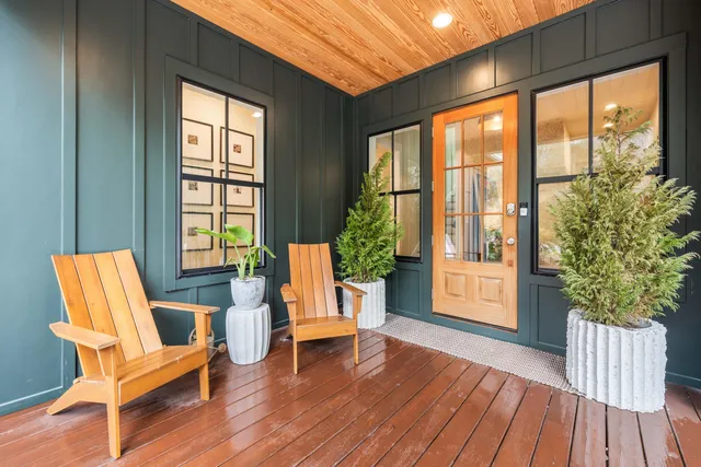 a living room filled with furniture and wooden floor