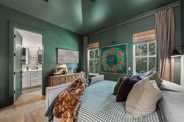 a bed room with a bed and a large window