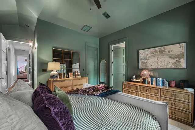 a living room with furniture a rug and a large window