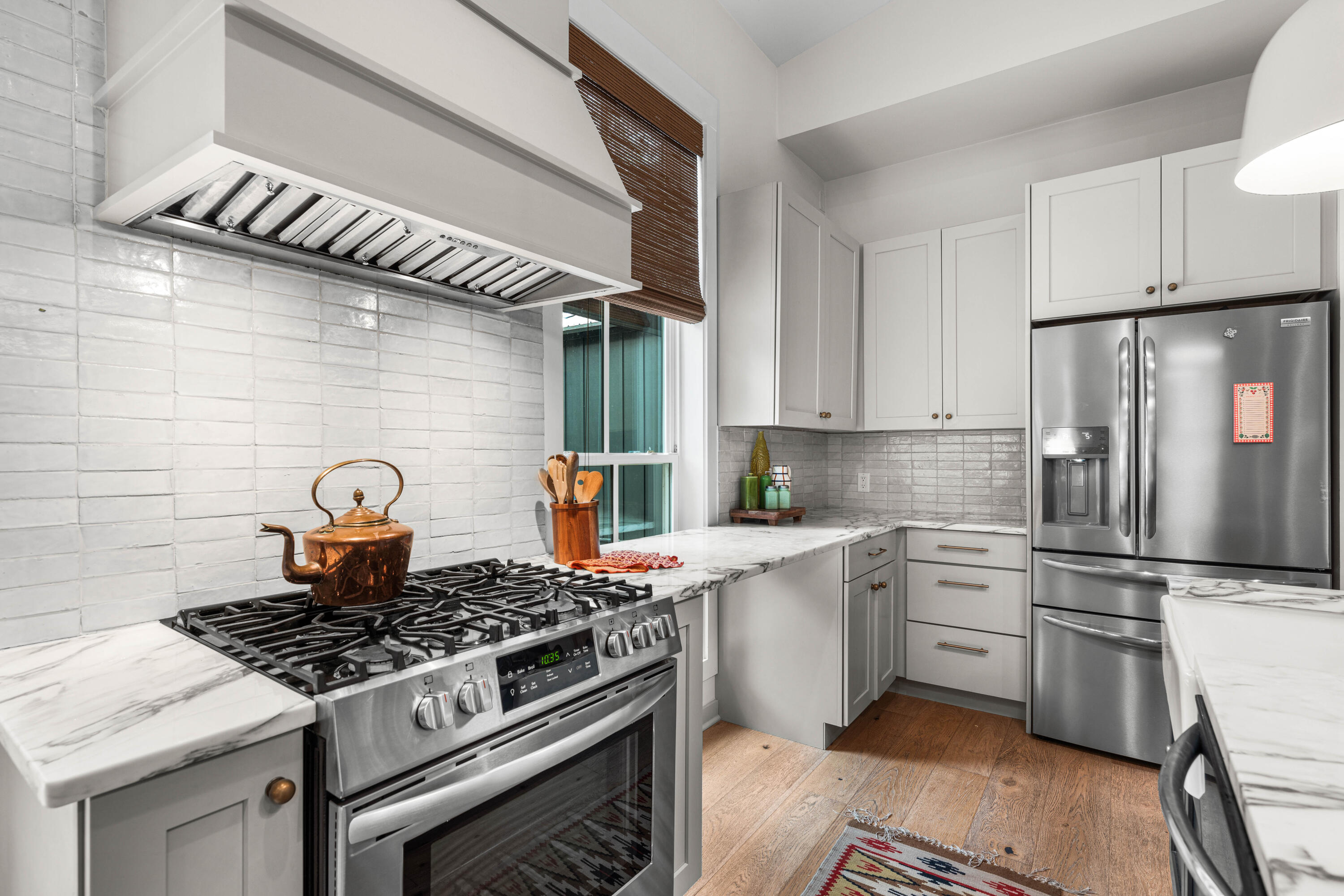 294 West Point Washington Road Santa Rosa Beach, FL 32459 - Photo 7 of 46 a kitchen with stainless steel appliances granite countertop a stove a refrigerator and a stove