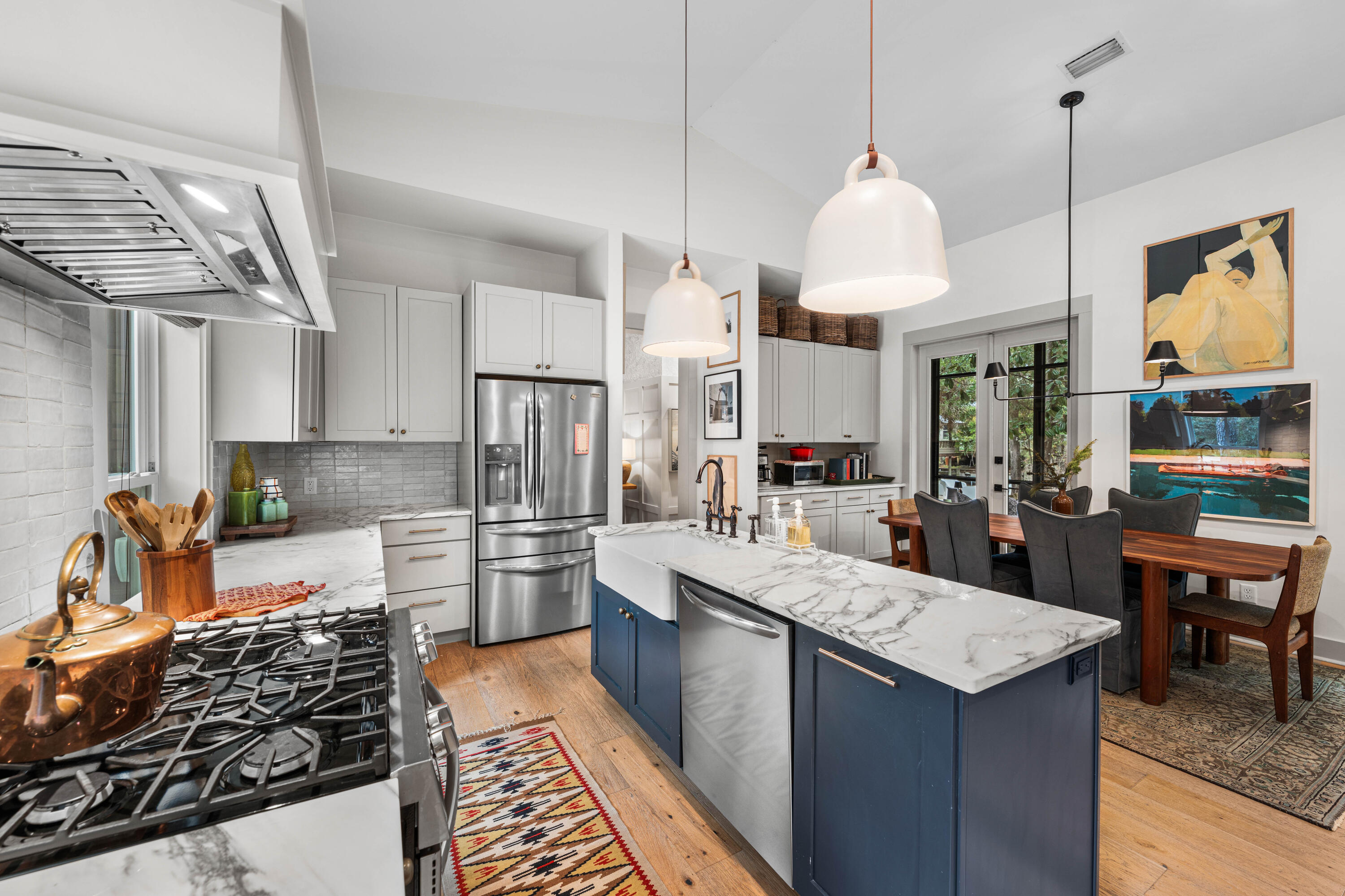 294 West Point Washington Road Santa Rosa Beach, FL 32459 - Photo 9 of 46 a kitchen with a stove a sink a refrigerator and chairs