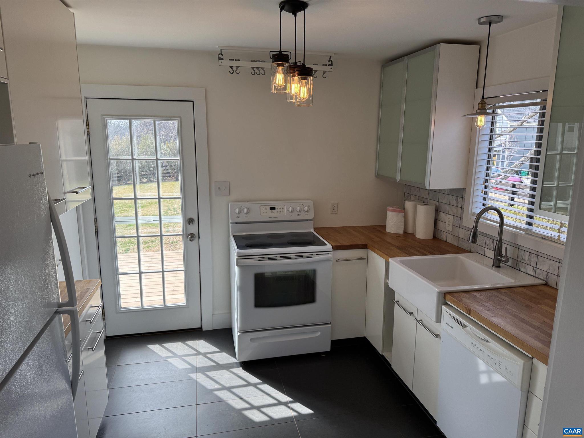 402 Harris Road Charlottesville, VA 22903 - Photo 5 of 10 a kitchen with a stove oven and sink