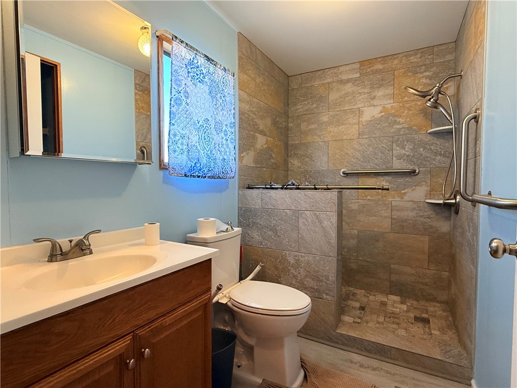 1637 Talc Road Bullhead City, AZ 86442 - Photo 21 of 37 Full bathroom with vanity and tiled shower