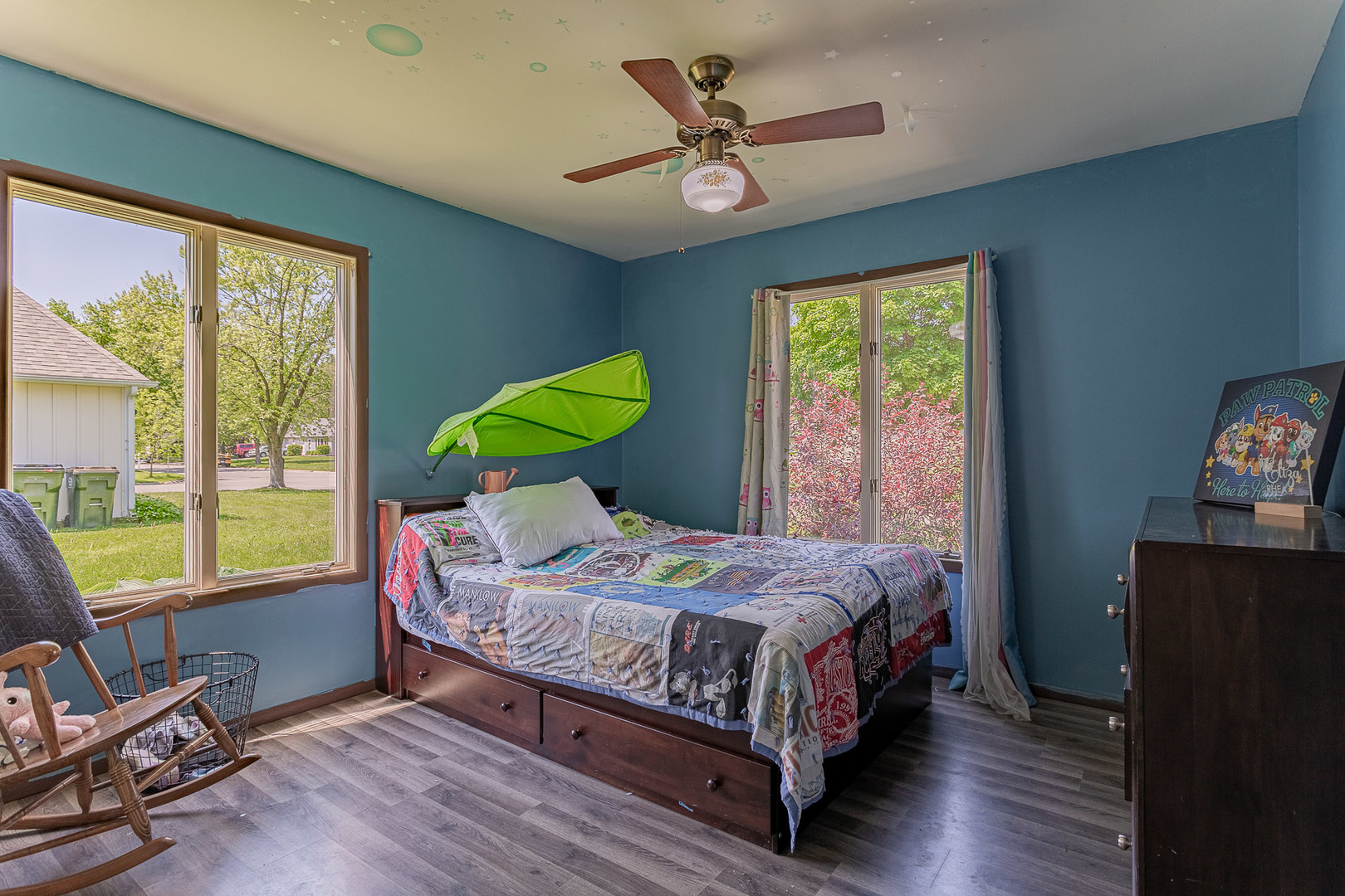 33 Ingleshire Road Montgomery, IL 60538 - Photo 12 of 22 a bedroom with a bed a large window with wooden floor and a balcony