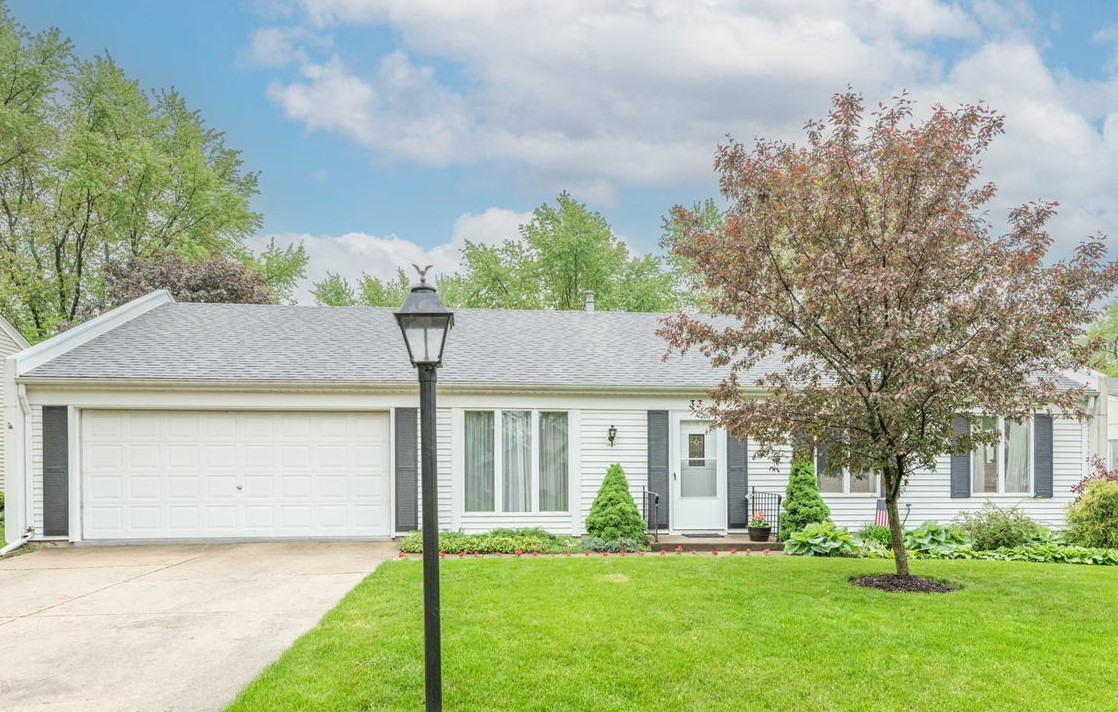 33 Ingleshire Road Montgomery, IL 60538 - Photo 22 of 22 a front view of a house with a yard and garage