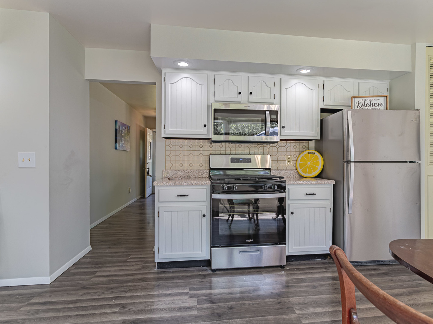 33 Ingleshire Road Montgomery, IL 60538 - Photo 7 of 22 a kitchen with stainless steel appliances a refrigerator stove and microwave